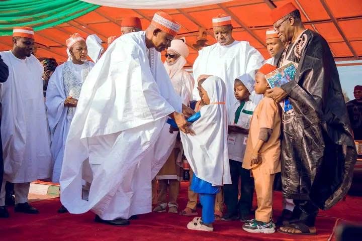 DISTRIBUTED FREE UNIFORMS AND TEXTBOOKS TO PRIMARY SCHOOL STUDENTS